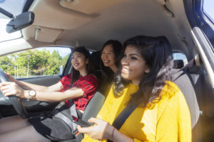 Happy women in car